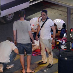 Turkish rescue services help a wounded person outside Ataturk Airport in Istanbul, Tuesday, June 28, 2016. Two explosions have rocked Istanbul's Ataturk airport, killing several people and wounding others, Turkey's justice minister and another official said Tuesday. A Turkish official says two attackers have blown themselves up at the airport after police fired at them. The official said the attackers detonated the explosives at the entrance of the international terminal before entering the x-ray security check.